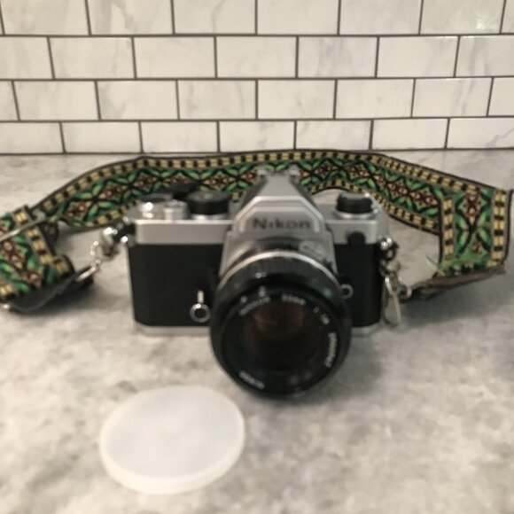 Nikon FM silver 35mm SLR Film Camera Ai Nikkor 50mm f1.4 lens Japan with Strap - Picture 1 of 9